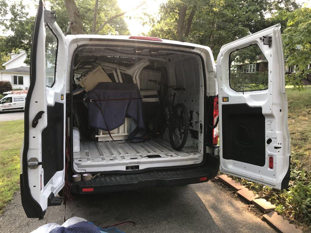 Person researching moving company credentials online on a laptop