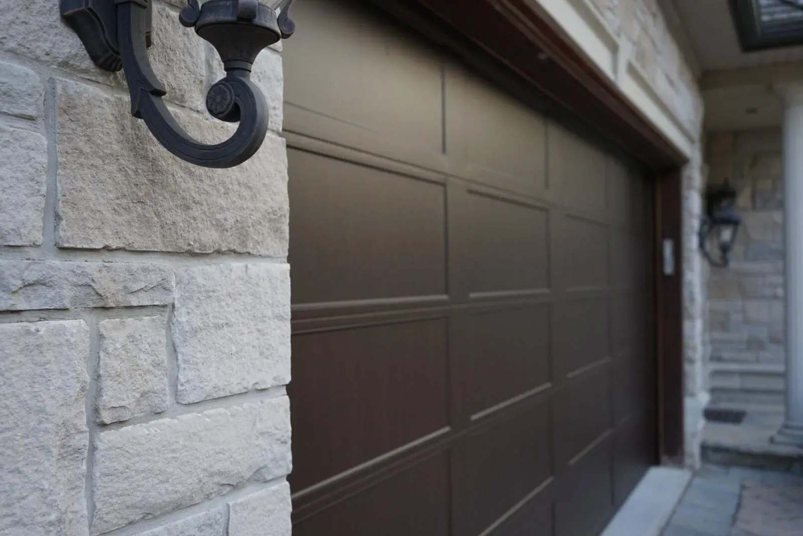 Technician arriving for an emergency garage door repair at night