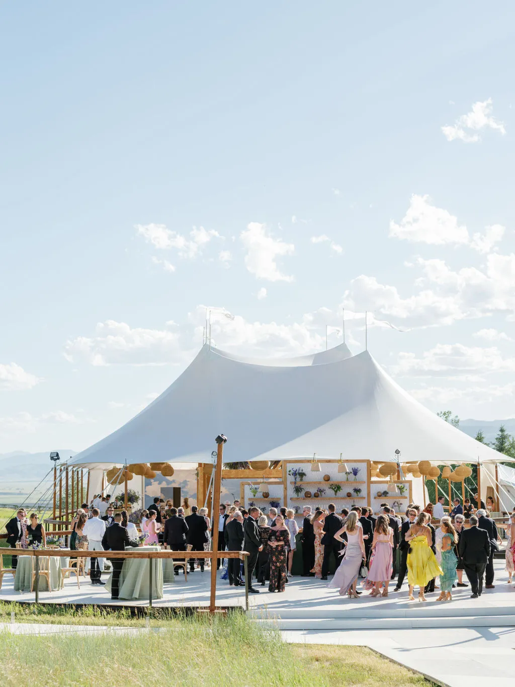 Technician conducting safety checks on generator equipment at an outdoor wedding venue