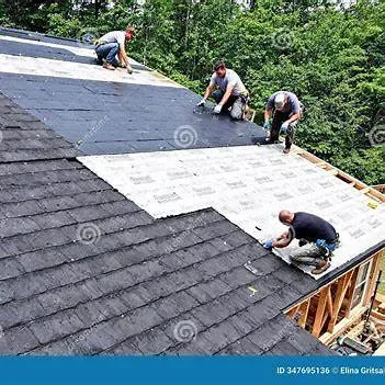 Licensed roofing inspector discussing findings with a property owner