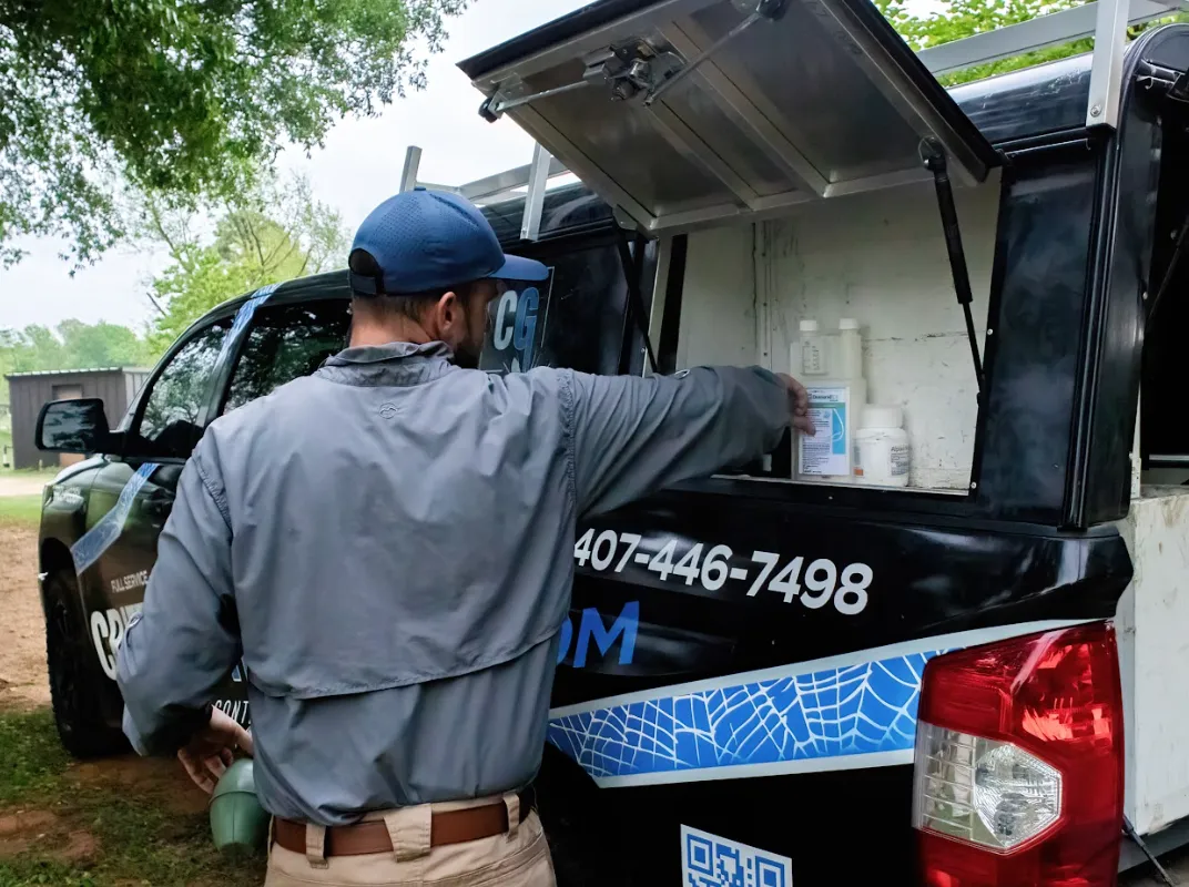 Professional pest control technician examining a home for pests in Texas