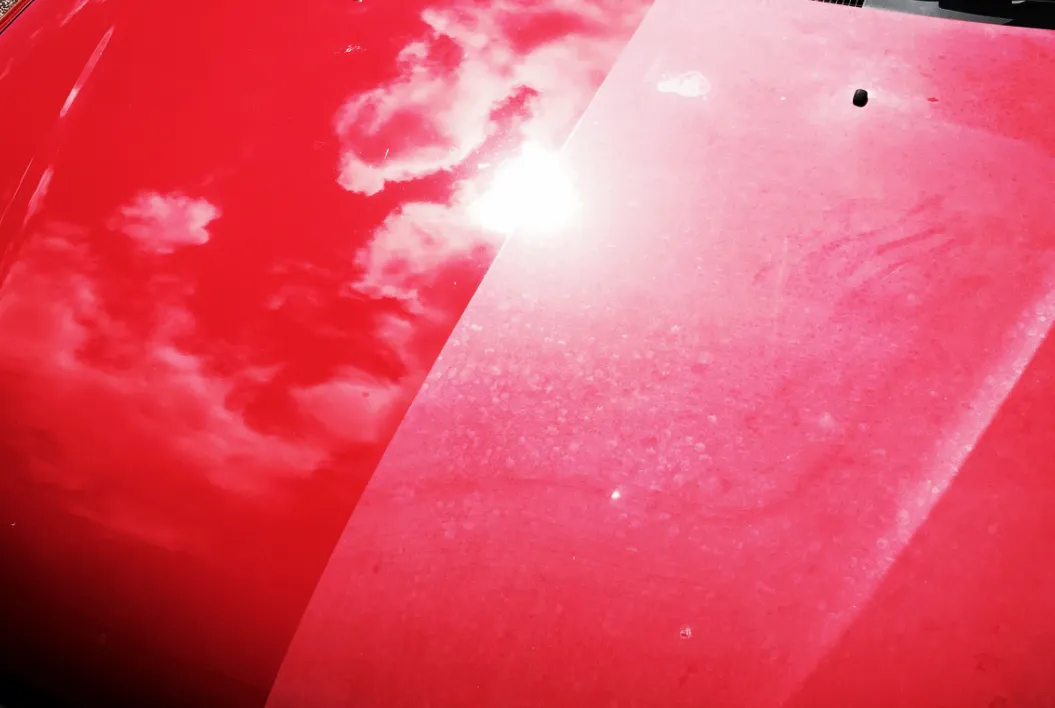 Shiny vehicle with ceramic coating reflecting sunlight, showcasing paint protection benefits