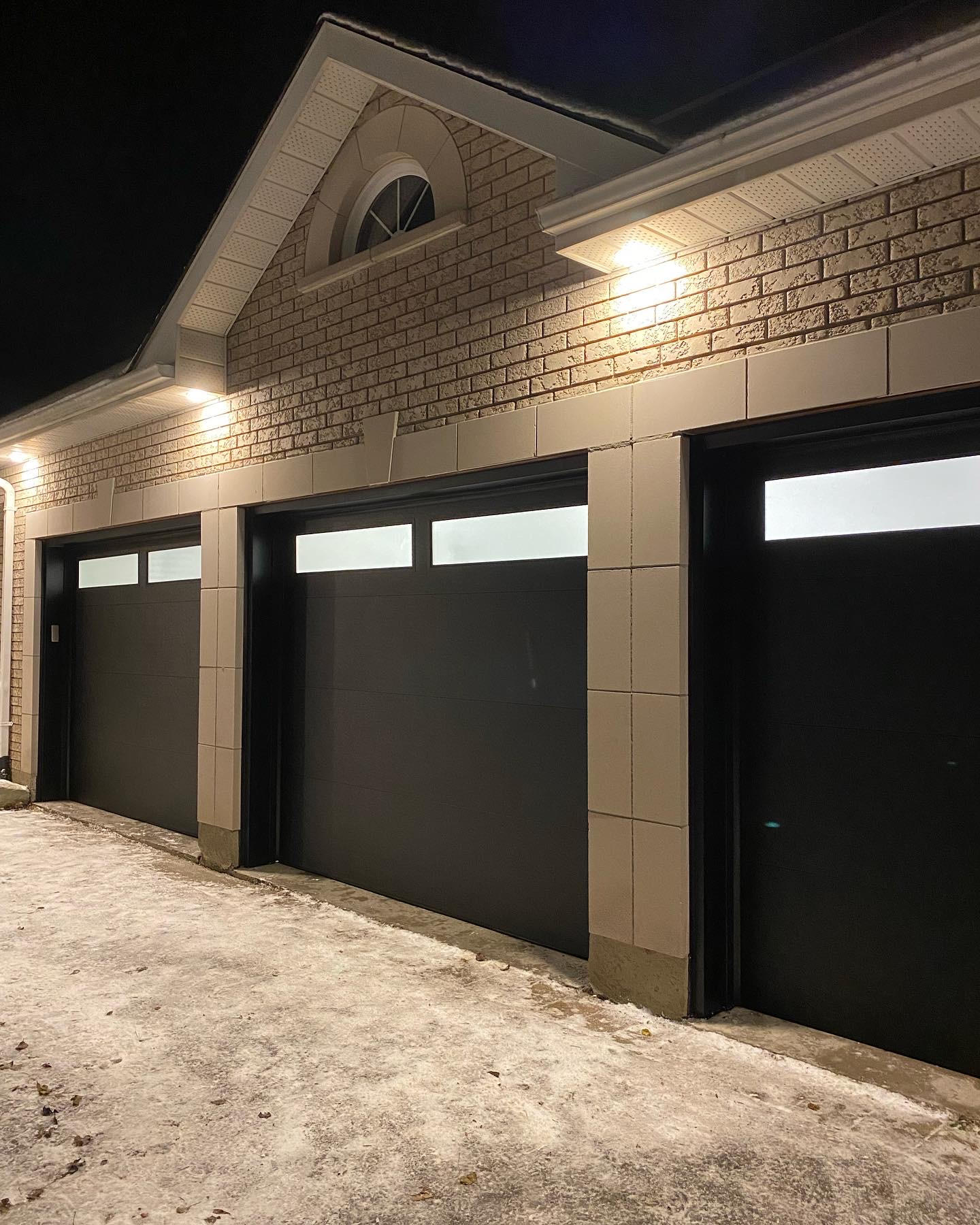 Garage door technician inspecting a residential garage door in Toronto