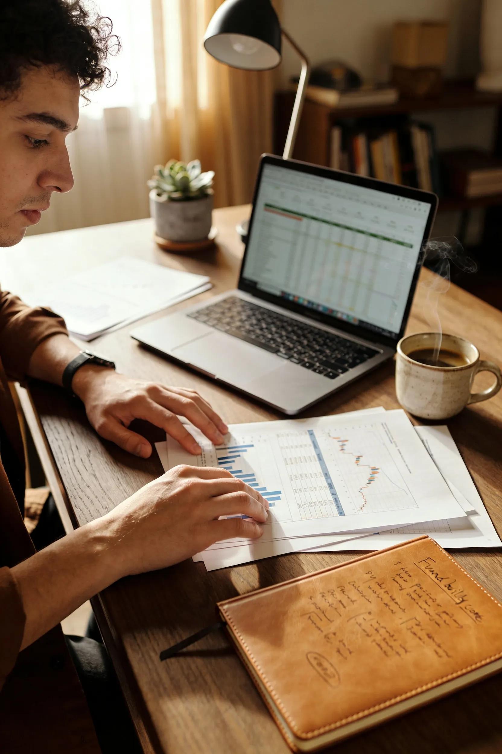 Small business owner reviewing financial documents to improve fundability score