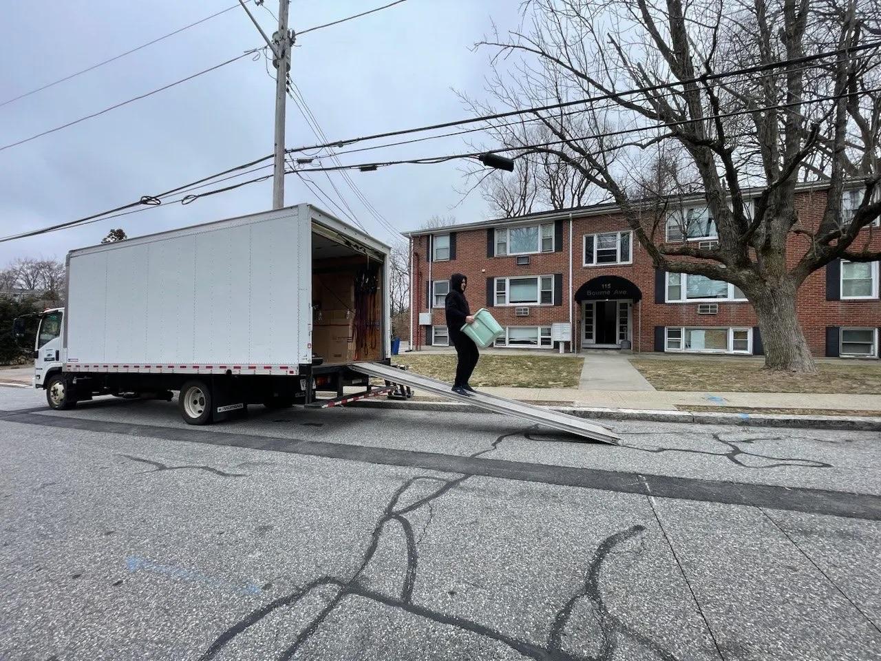 Moving truck and family loading boxes for an interstate move