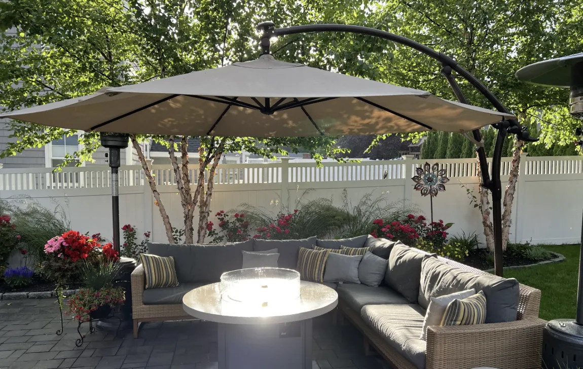 Outdoor living space featuring sustainable materials like recycled pavers and native plants in a beautiful patio setting