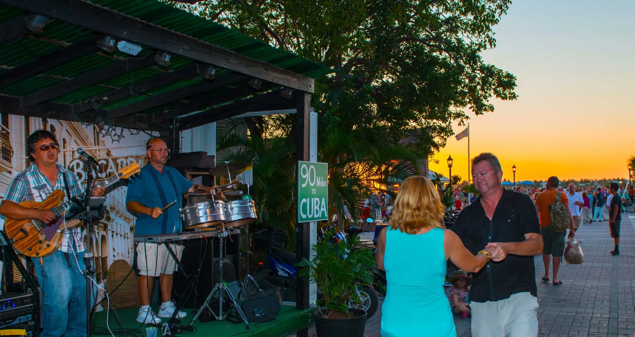 Live music performance at a bar in Key West with a lively audience enjoying the vibrant atmosphere