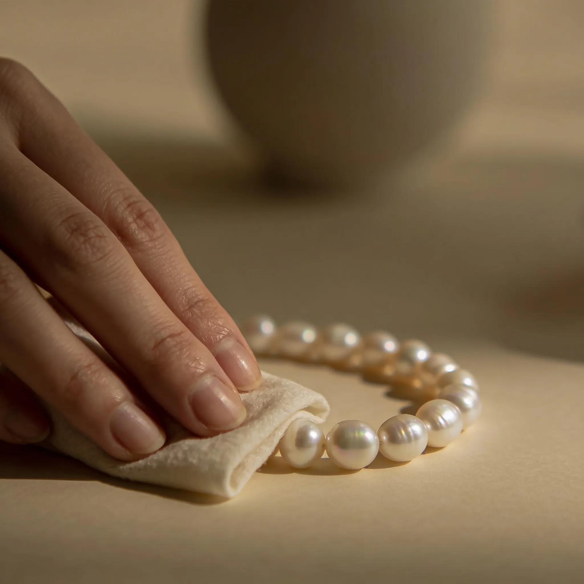 Properly maintaining and cleaning pearls to preserve their luster, showcasing delicate care techniques