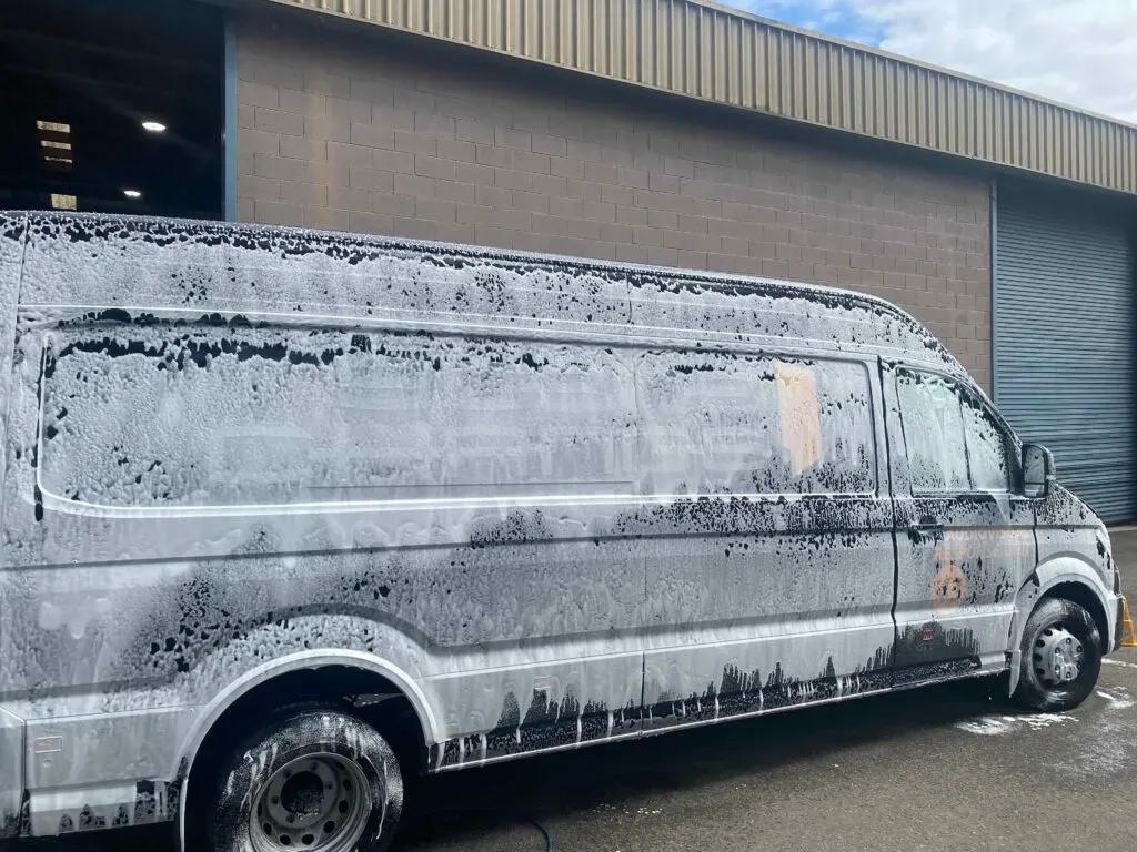 Vehicle receiving filtered water wash emphasising protection against coastal environmental factors