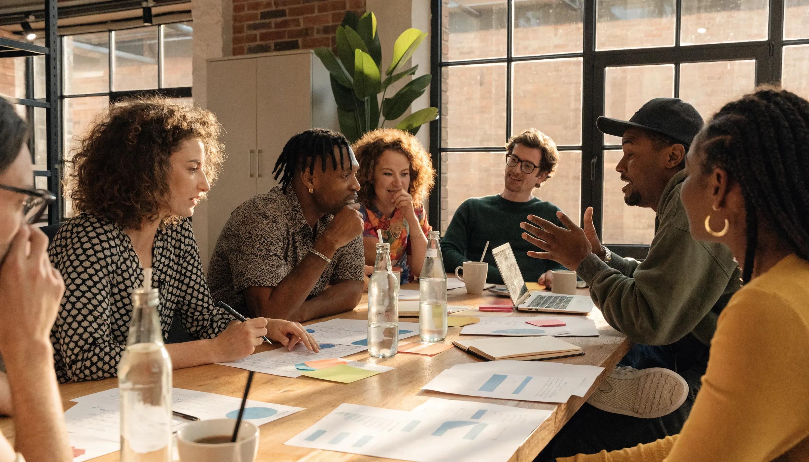 Entrepreneurs discussing funding choices in an office