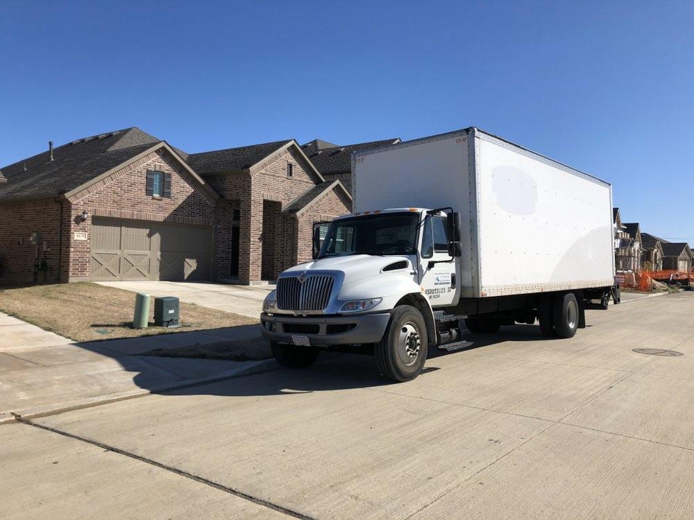 Moving truck parked outside a Providence residential home