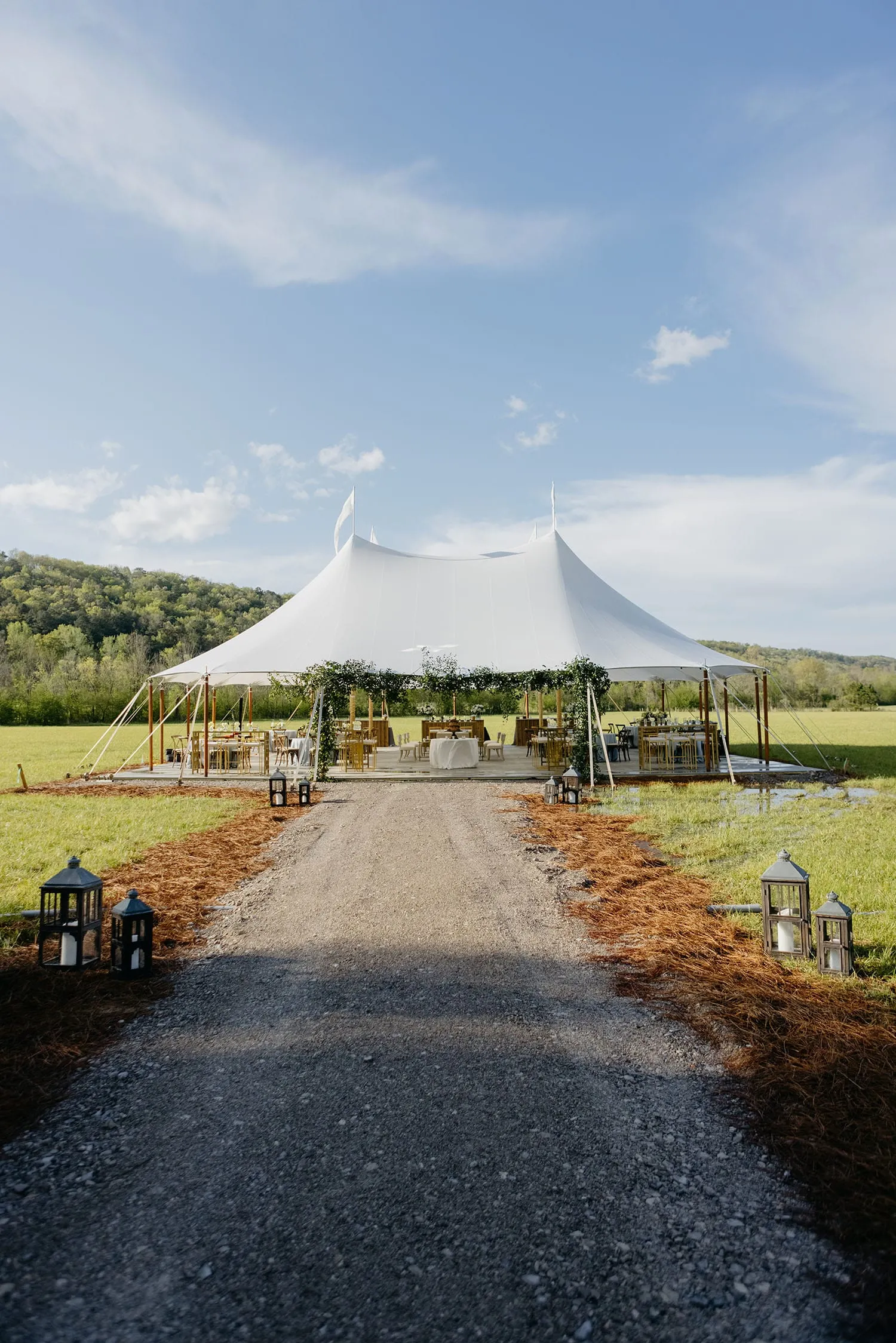 Luxury summer event with hardwood flooring on a beautifully landscaped lawn
