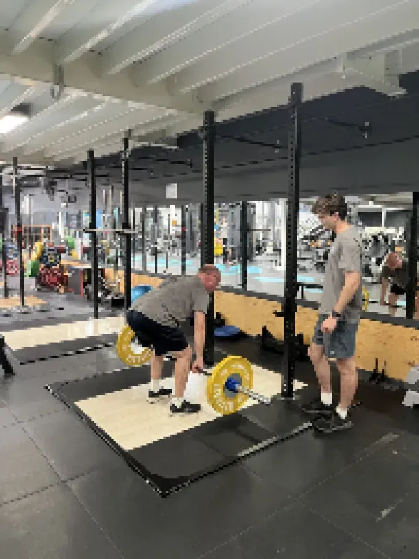 Group training session at Fortify Personal Training with clients engaged in a motivating fitness environment