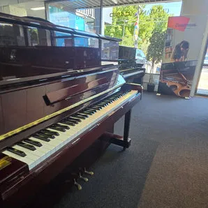 Display of recommended piano brands in a music store, showcasing quality and craftsmanship