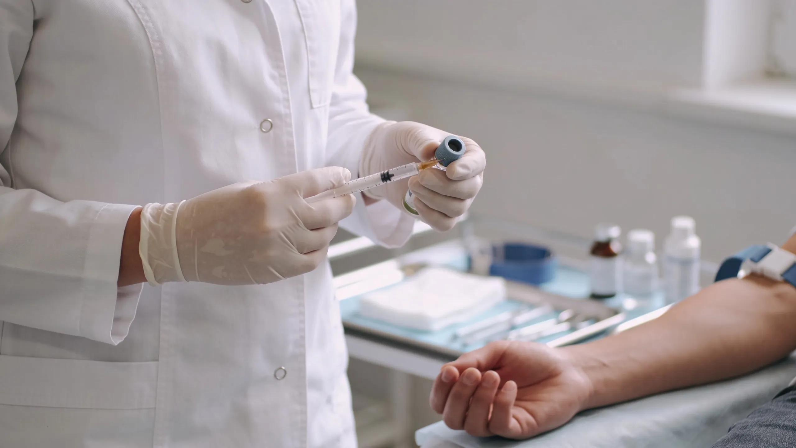 Healthcare provider preparing injectable treatments for fat reduction in a professional clinic setting in Bryan TX
