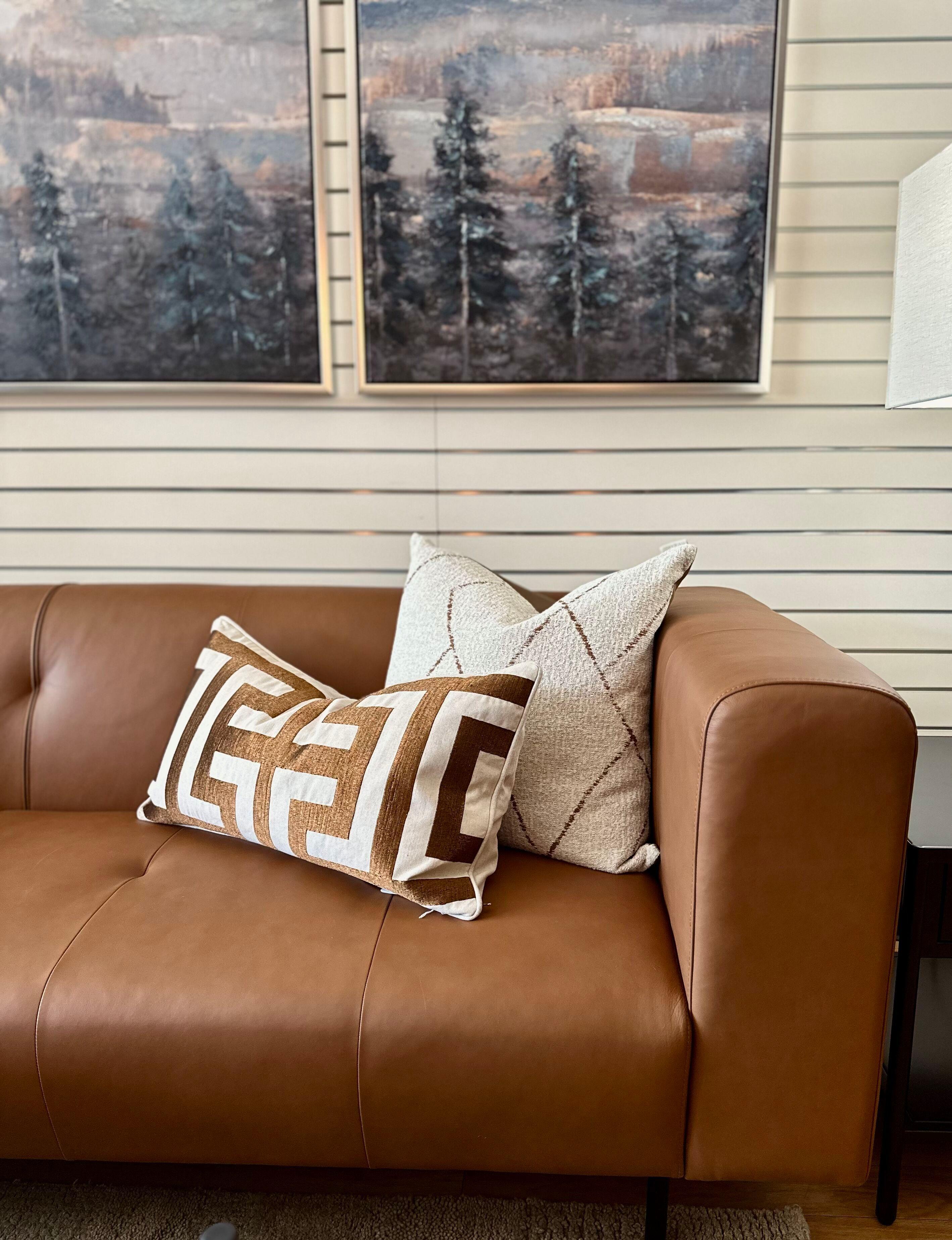 Close-up of a traditional sofa showcasing hardwood frame and leather upholstery, emphasizing quality materials