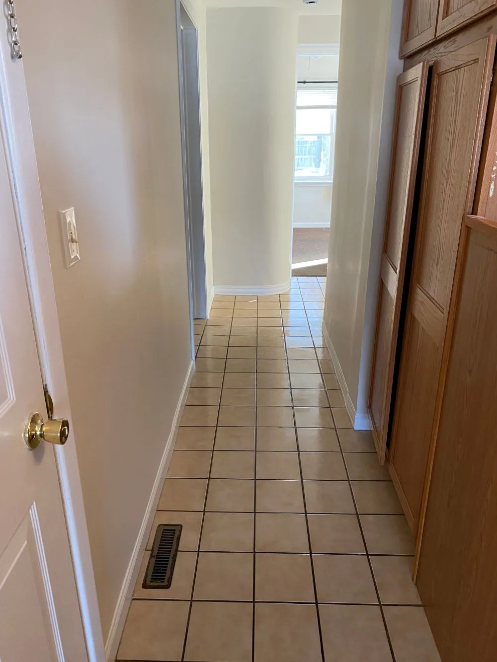 Clean, brightly lit hallway in a modern office building, showcasing professional commercial cleaning.
