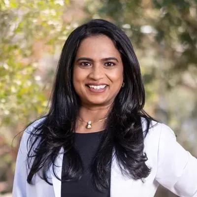 Dr. Arpita Surkunte, MD — Board-certified physician and founder of Amped MD