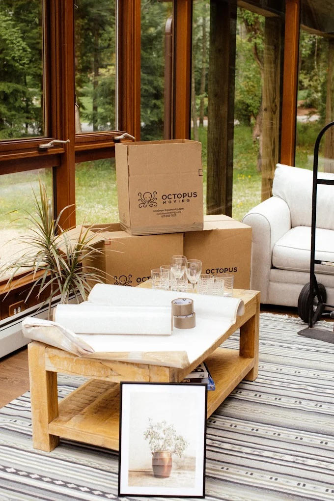 Person booking moving services online with a laptop