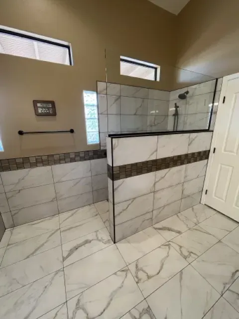 Modern bathroom with walk-in shower and freestanding bathtub, showcasing spa-like design elements
