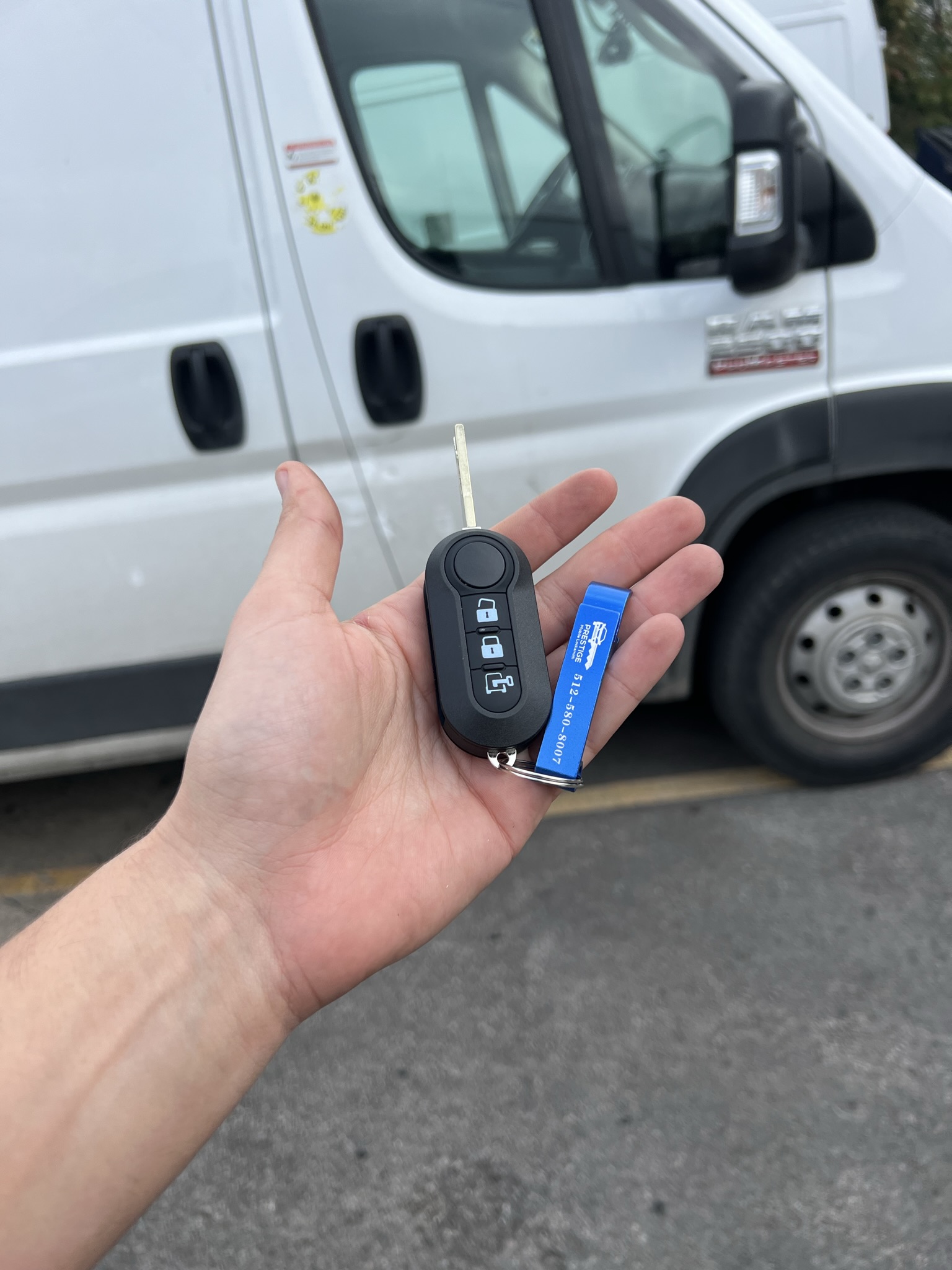 Locksmith servicing a commercial vehicle, highlighting key replacement and lockout assistance services