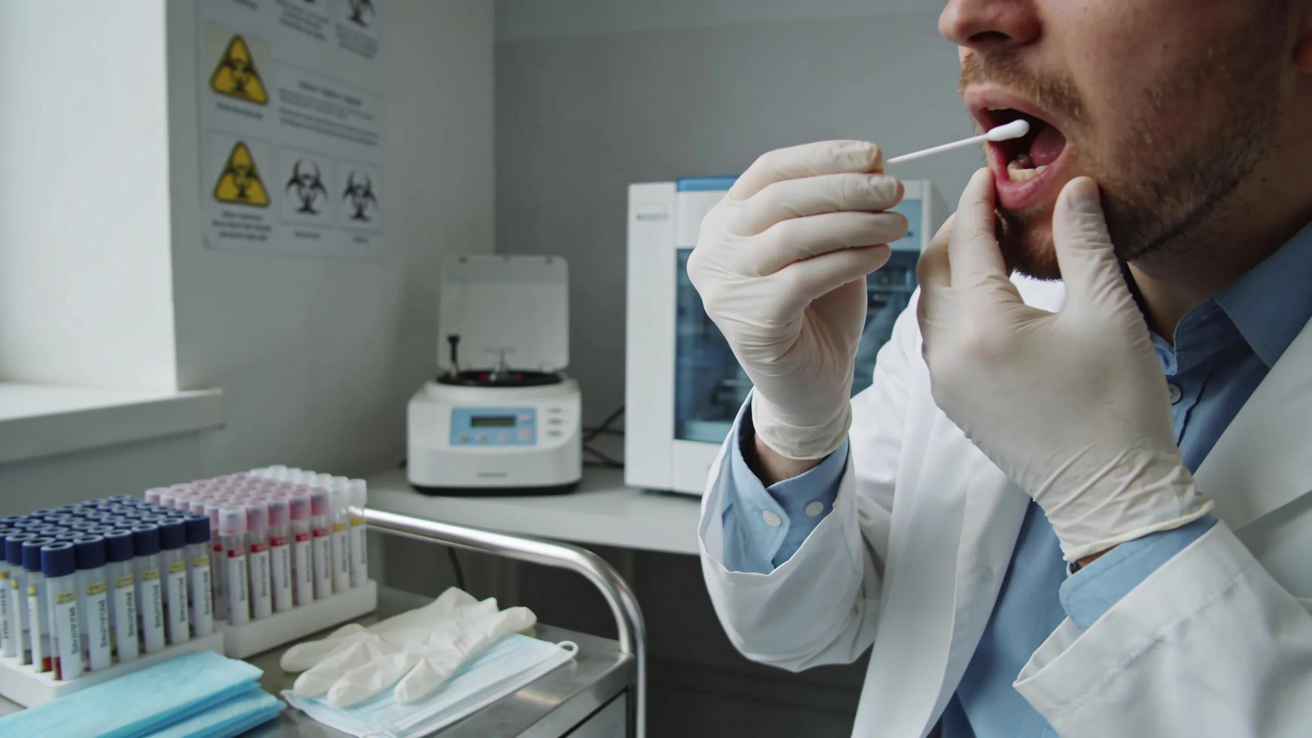 Professional conducting DNA sample collection for paternity testing