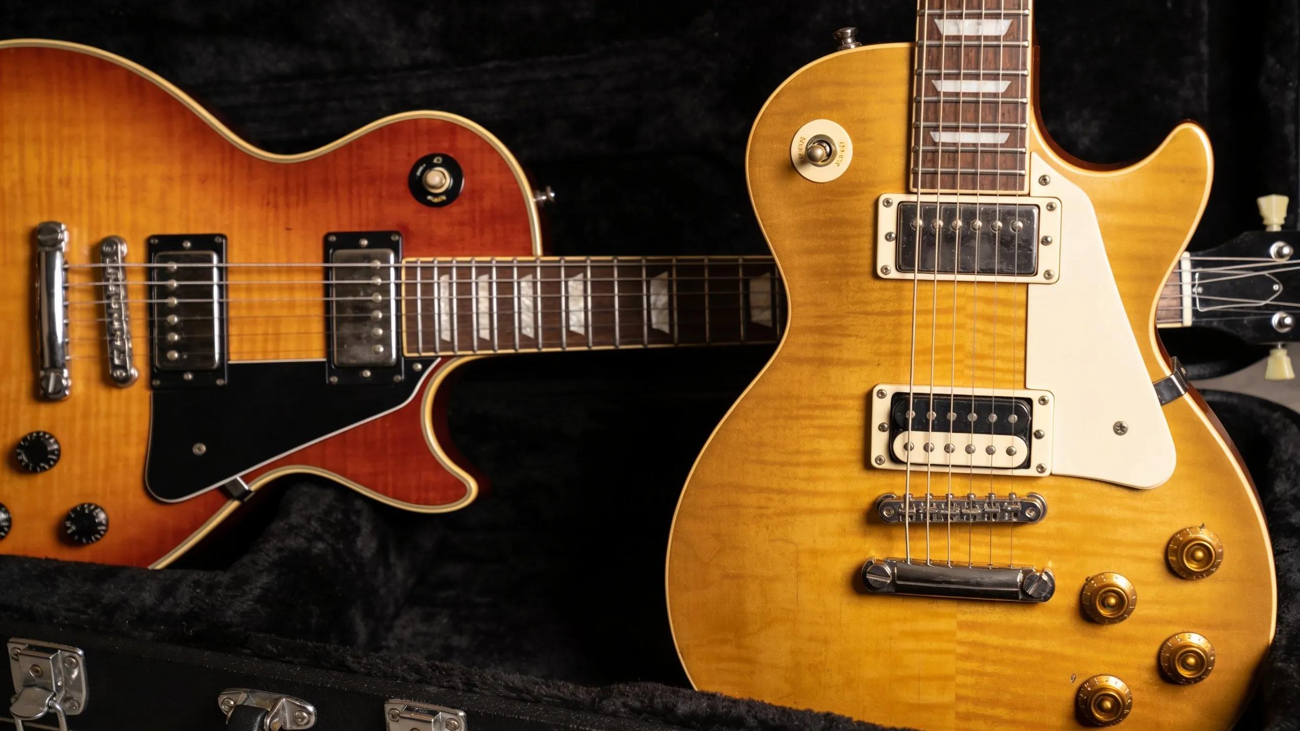 actual PRS Custom 24 and Gibson Les Paul electric guitars actual PRS Custom 24 and Gibson Les Paul electric guitars