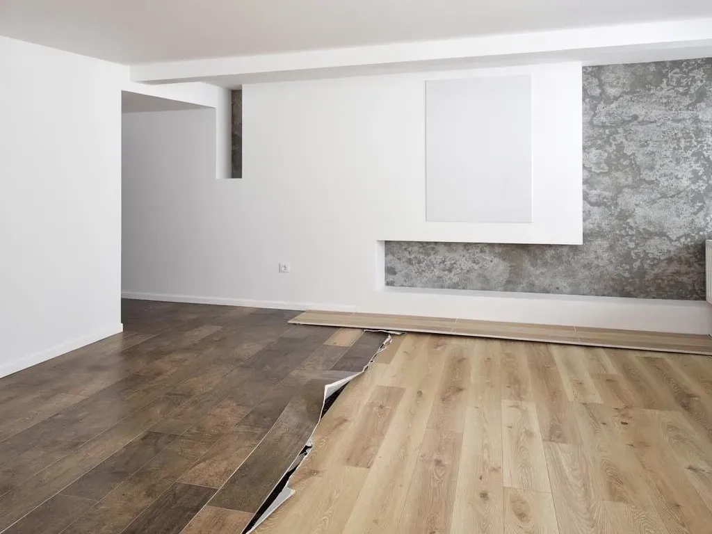 Mismatched transition strip placed awkwardly in the middle of a room