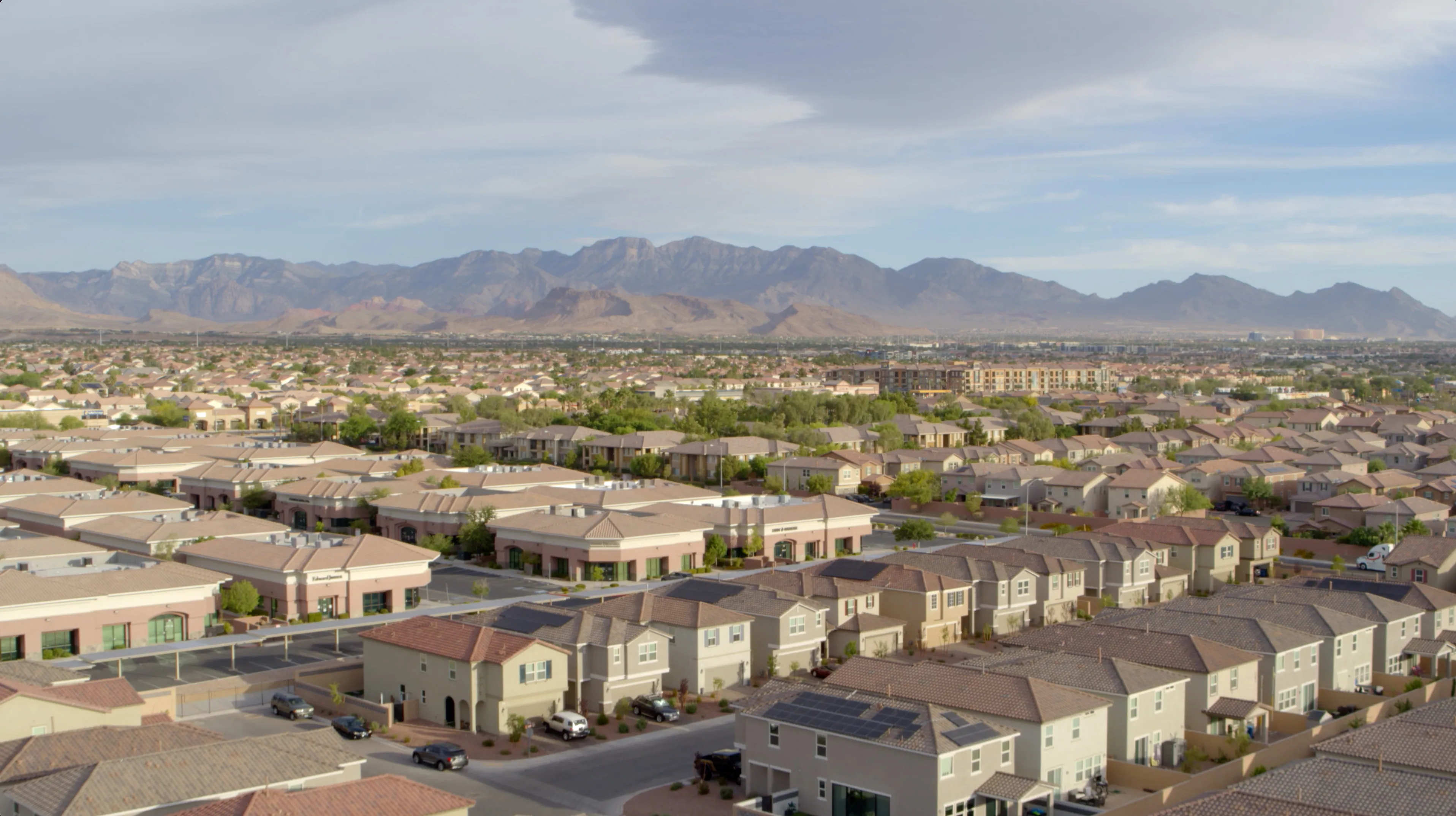 Expansive view of suburban homes with mountains in the background