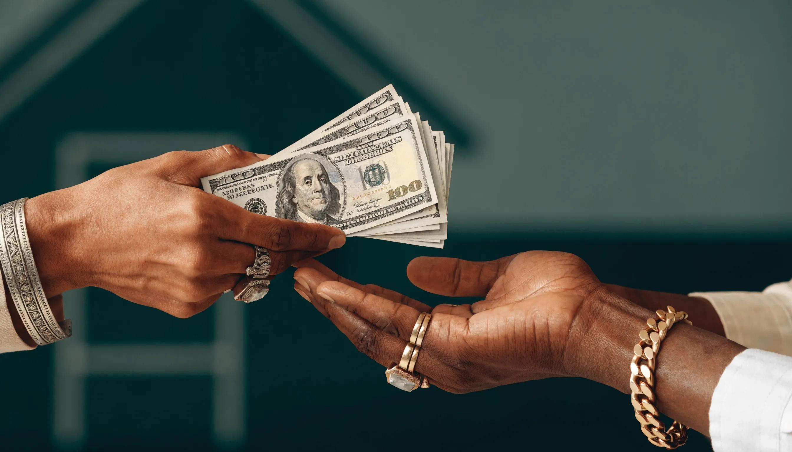 Cash exchange symbolizing a fast sale of an inherited home