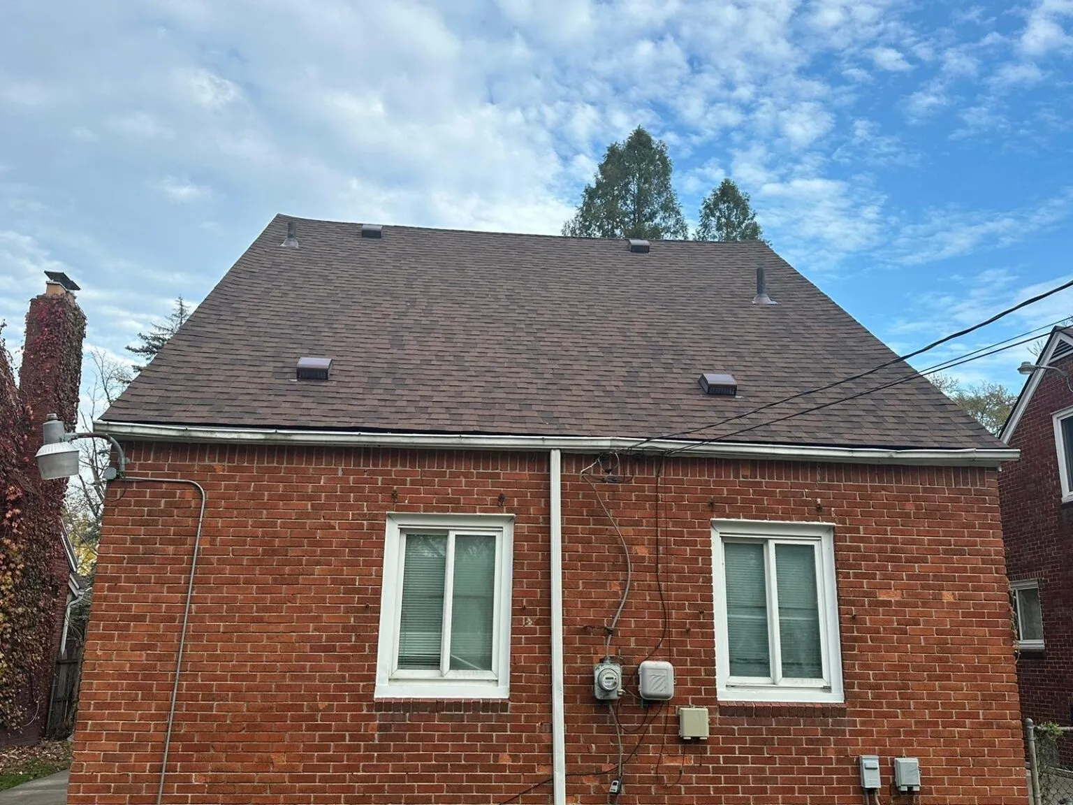 Damaged roof shingles showing signs of wear and water leaks requiring assessment