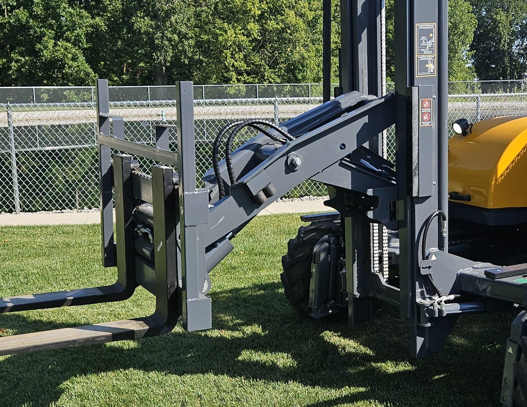 Operator using a Loadmac truck mounted forklift at ground level