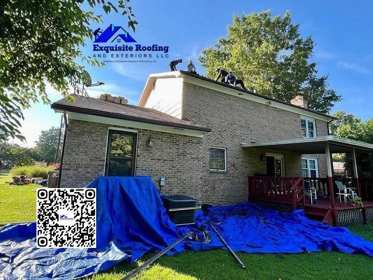 ### Key Elements - **Main Subjects**: Workers on the roof of a house - **Objects**: