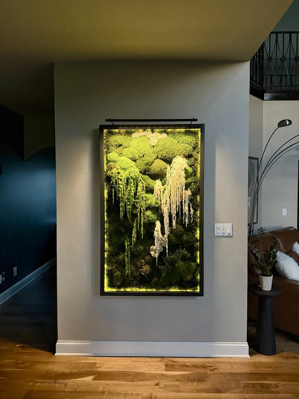 Panoramic view of a conference room showcasing preserved moss wall, highlighting acoustic and biophilic design benefits