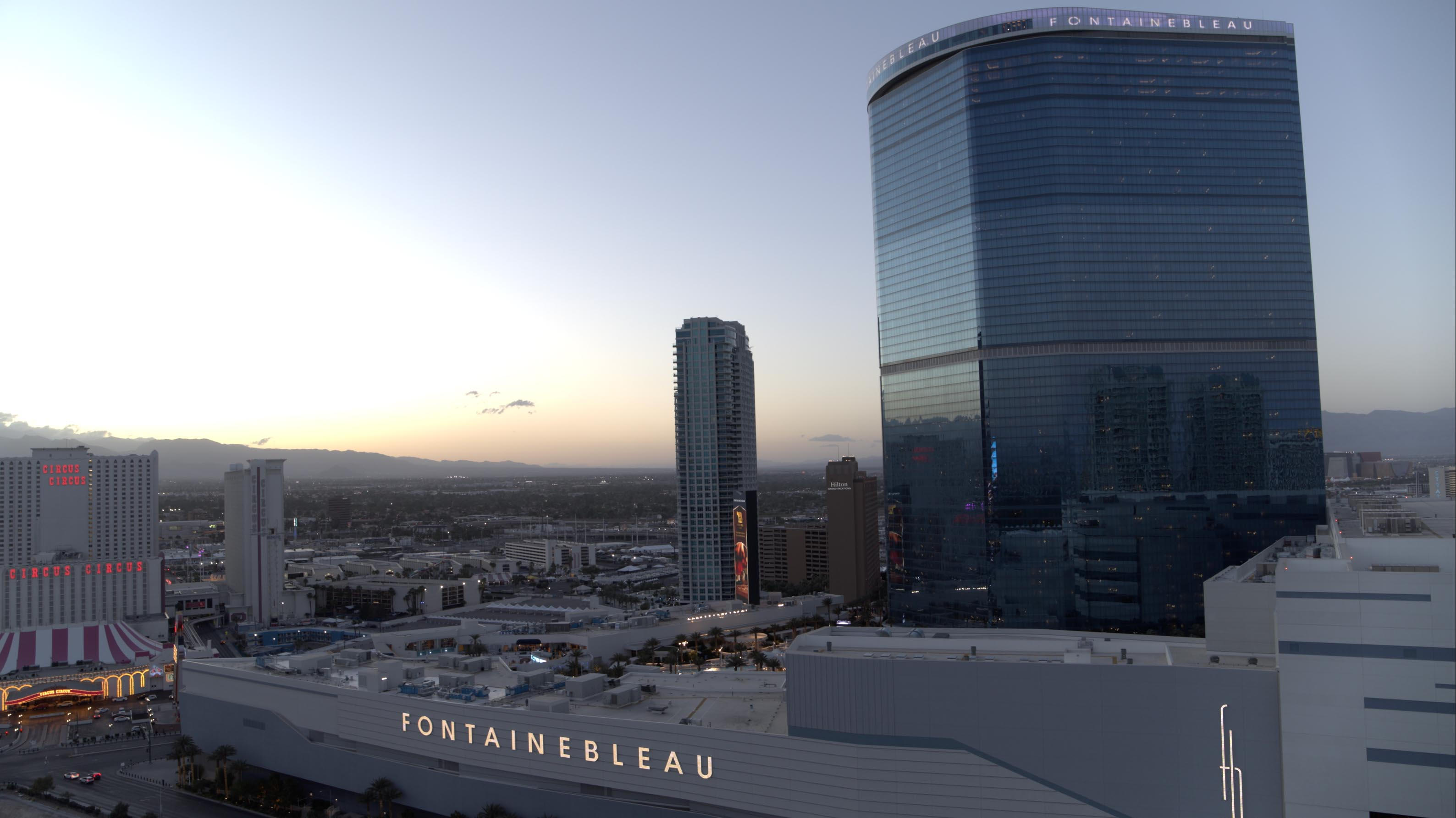 Fontainebleau skyscraper at sunset in Las Vegas, with nearby buildings and skyline