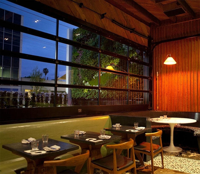 Glass Garage Doors in Restaurants and Assembly Spaces: Egress, Safety Glazing, and Occupant Load