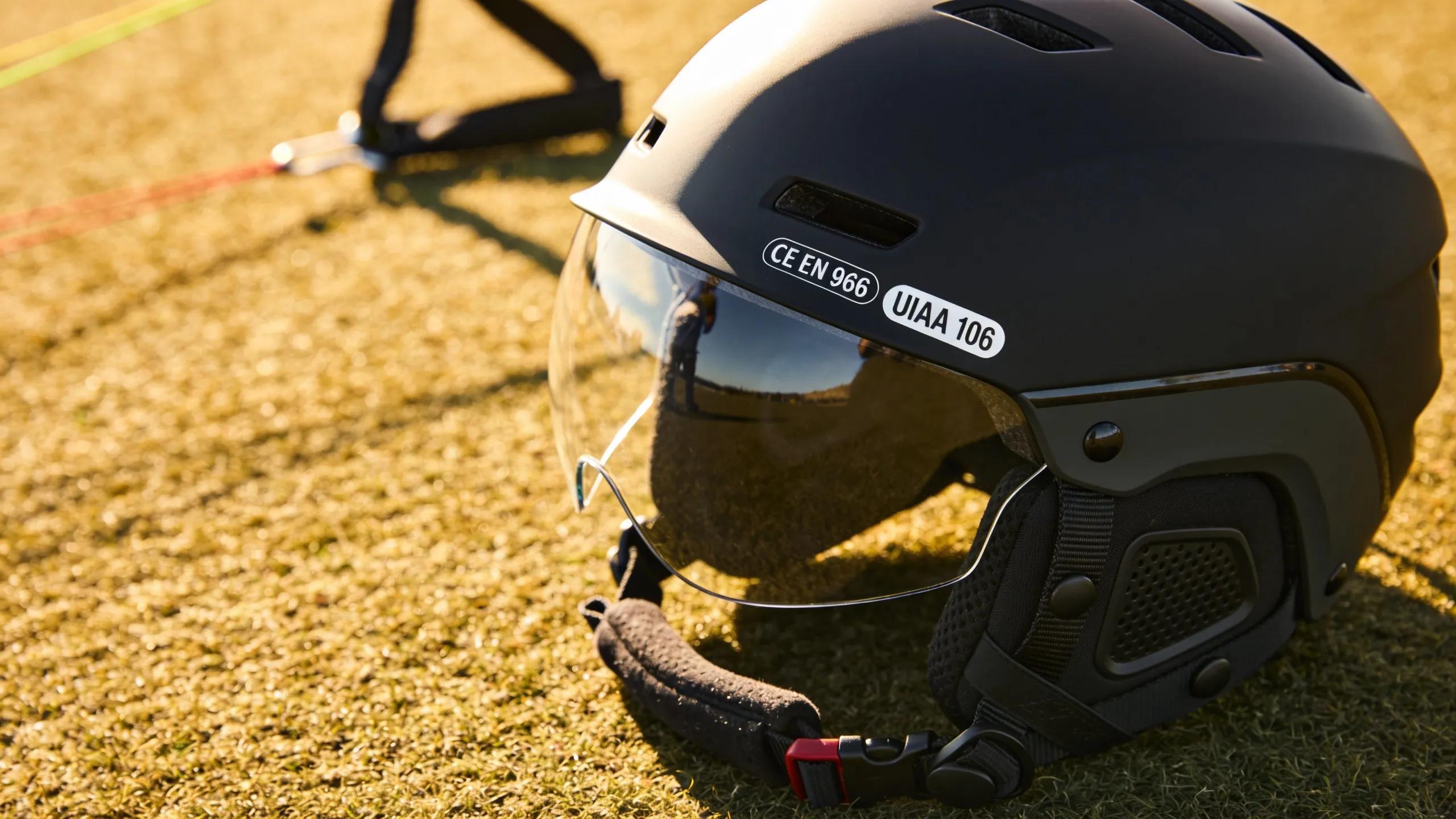 Close-up of a paragliding helmet highlighting safety certifications and design features essential for Australian conditions