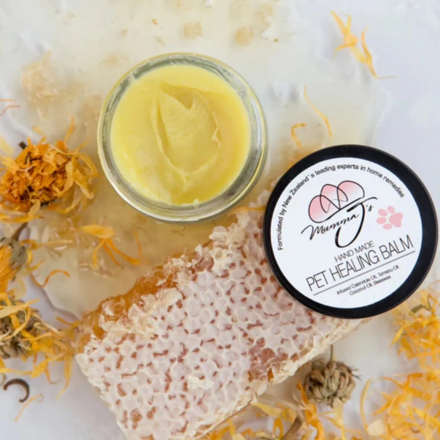 Textures of shea butter, calendula petals, and botanical oils demonstrating skin hydrating ingredients