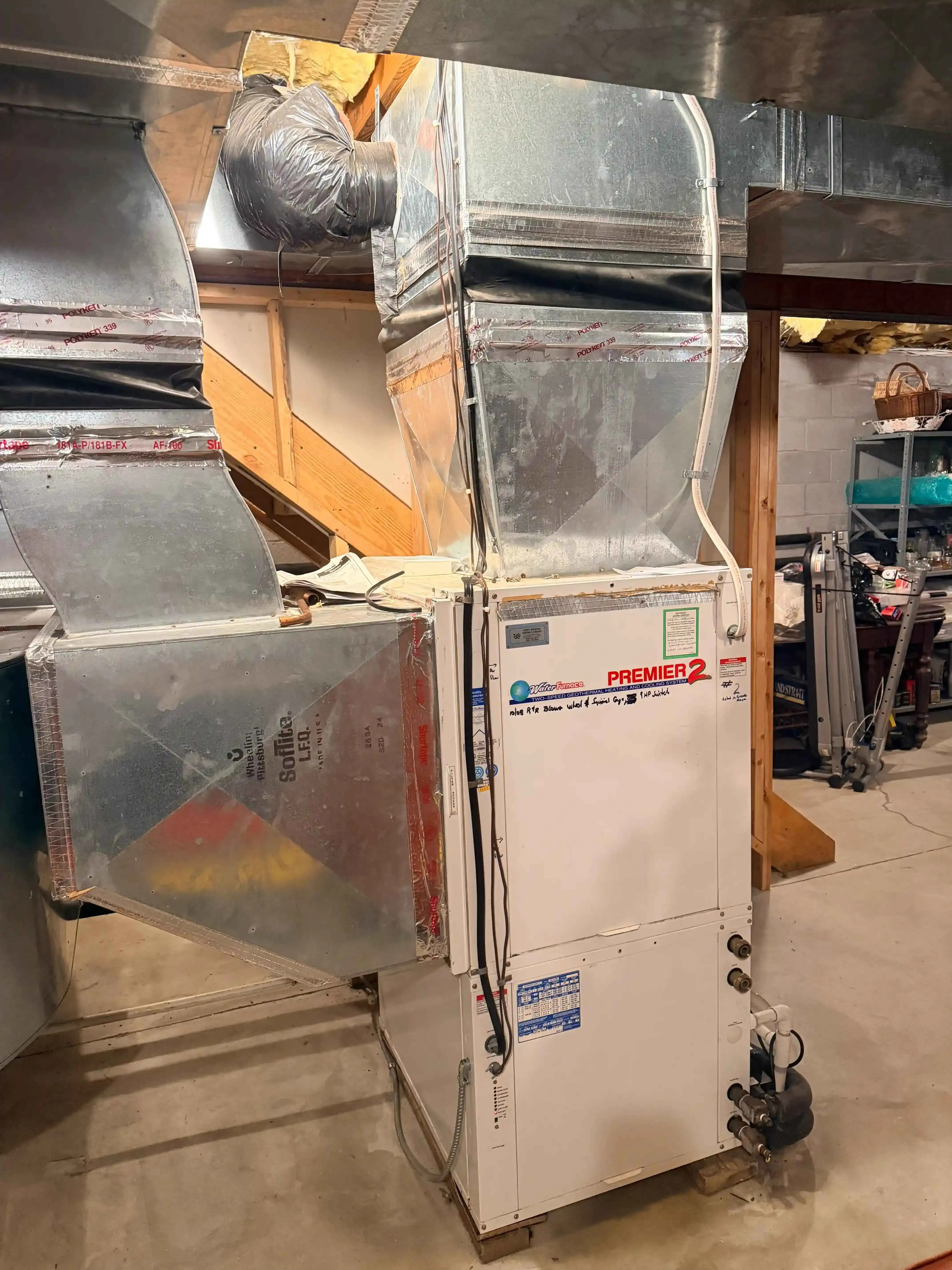 Comparison of modern gas and oil furnaces in a basement setting