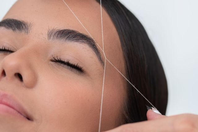 Precision Brow Sculpting: Threading vs. Waxing in Woodside