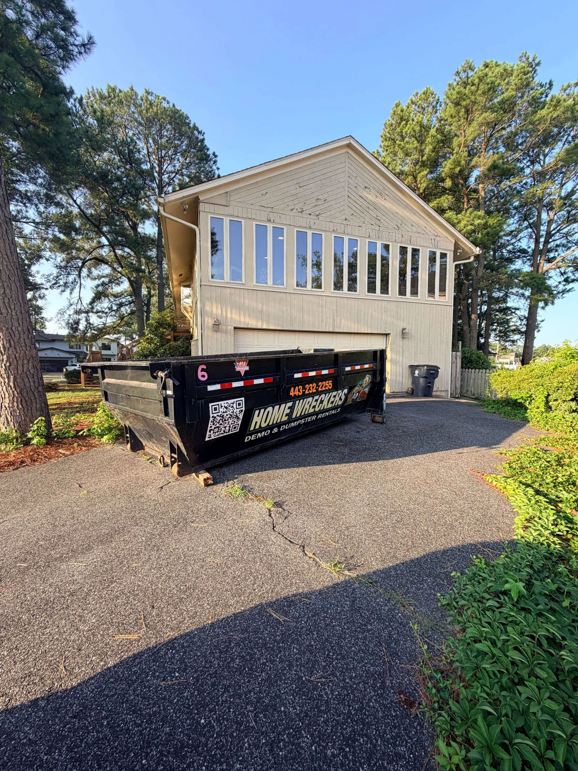 Home Wreckers Demolition and Dumpsters truck delivering a roll-off dumpster on Maryland's Eastern Shore