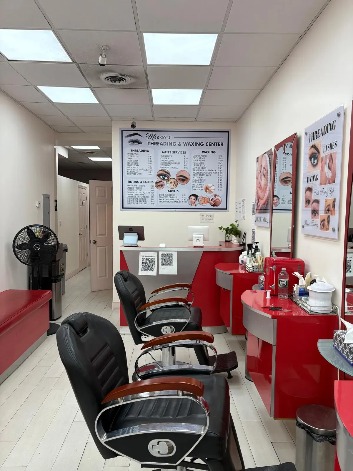 Beauty salon interior featuring a lash lift treatment area with a comfortable chair and beauty products