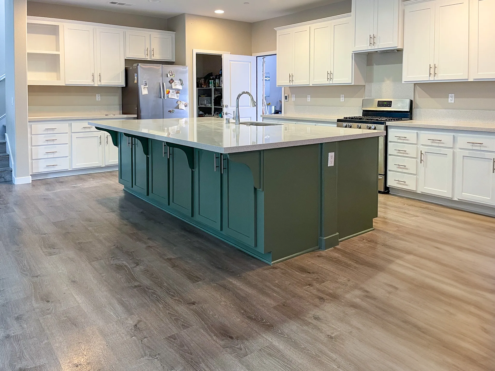 Vibrant kitchen cabinets with freshly painted surfaces, illustrating the professional cabinet painting process in Riverside