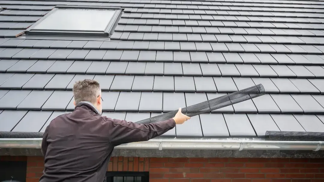 Roof inspector evaluating a residential roof in Olympia — the value of regular inspections for homeowners. Roof inspector evaluating a residential roof in Olympia — the value of regular inspections for homeowners.