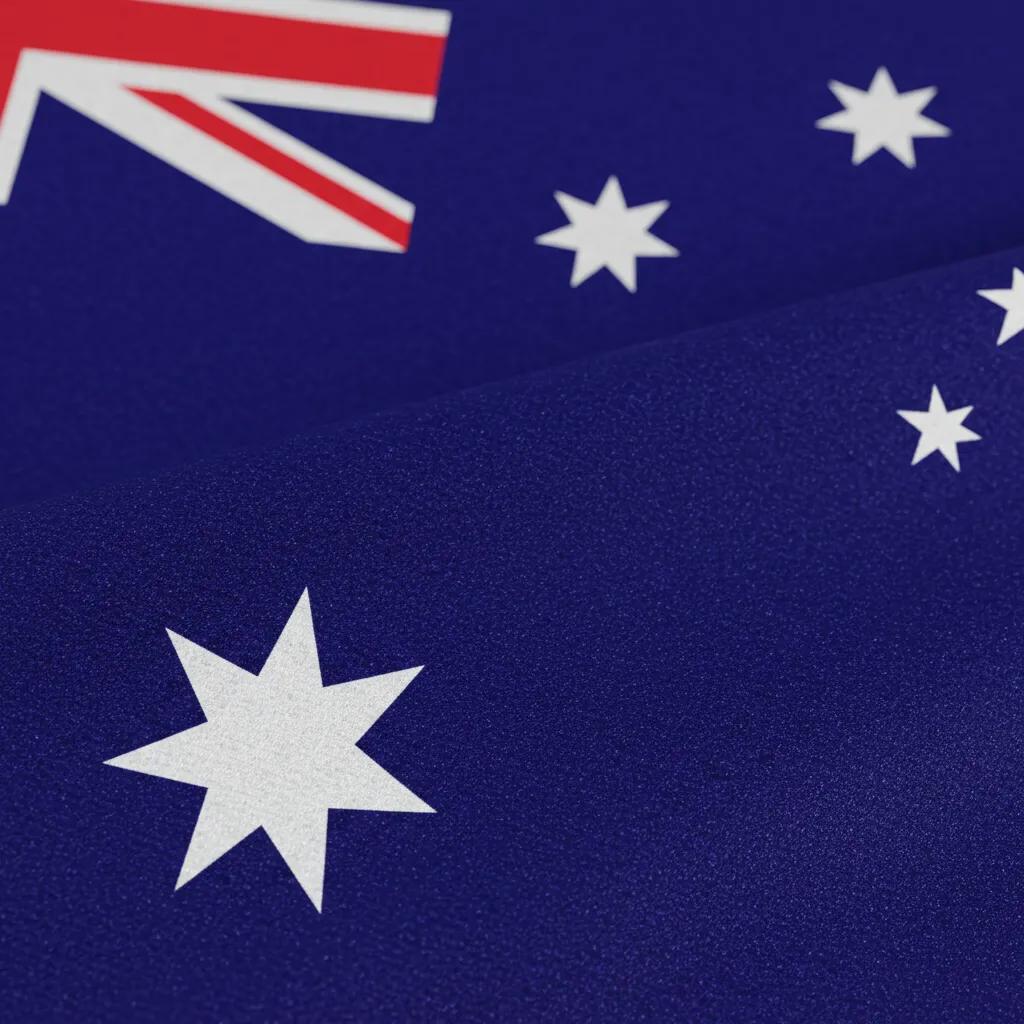 Close-up of heavy-duty woven polyester fabric and reinforced header of an Australian flag