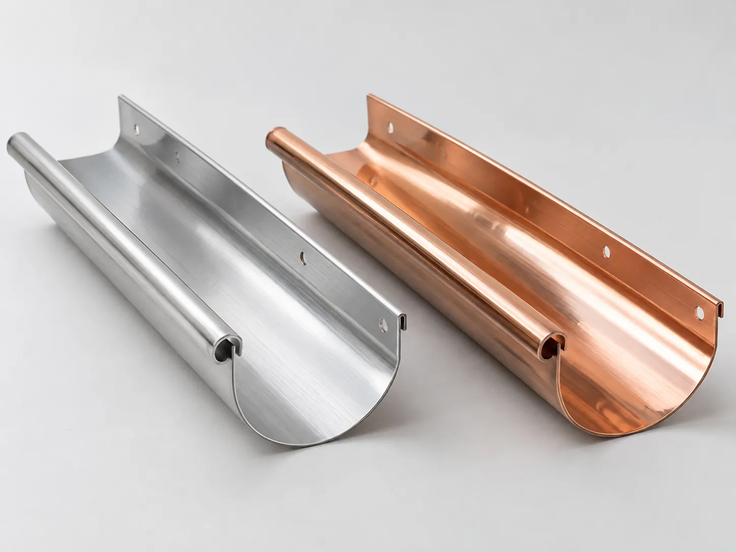 Aluminum and copper seamless gutter material samples for coastal homes