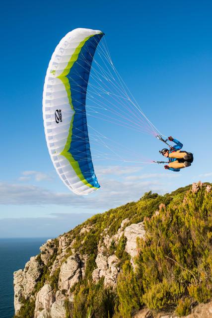 Comparison of Ozone Buzz Z6, Niviuk Ikuma, and Dudek Universal paramotor wings against an Australian backdrop