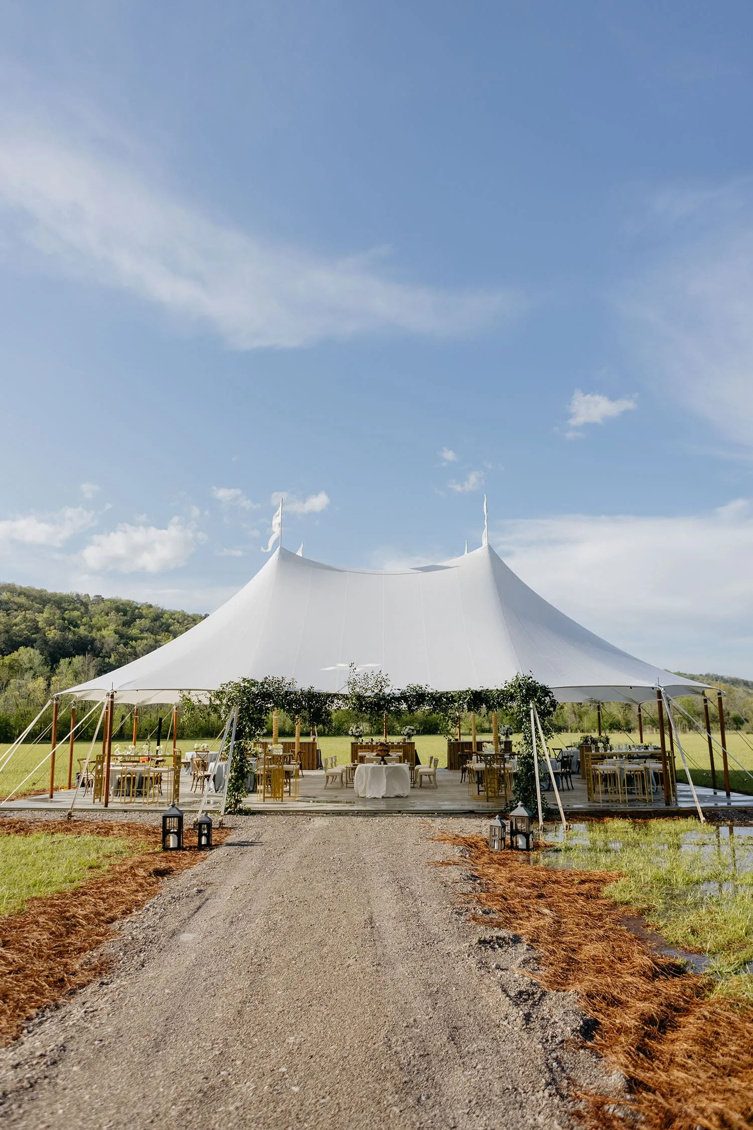 Luxury sailcloth tent showcasing romantic lighting for an evening reception