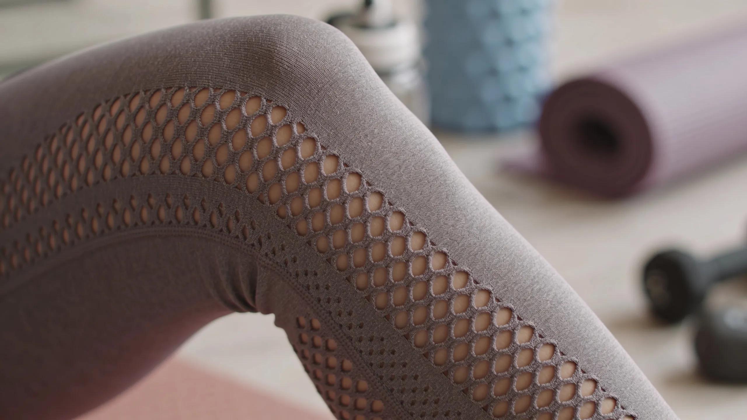 Close-up of breathable mesh fabric showcasing its texture and ventilation for workout leggings