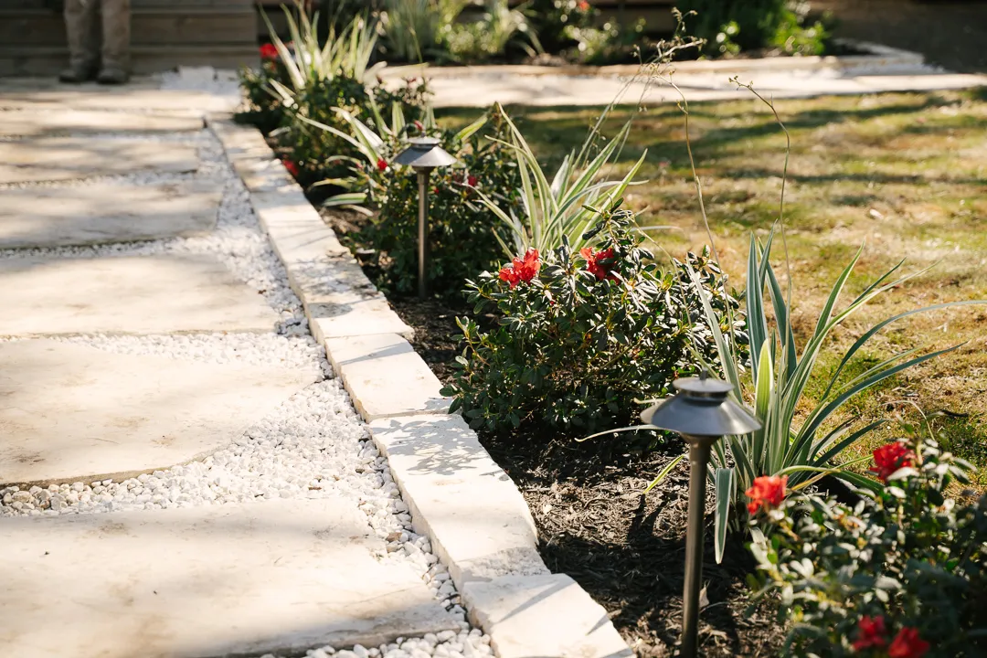 Modern landscape lighting in Houston outdoor space at dusk enhancing safety and ambiance Modern landscape lighting in Houston outdoor space at dusk enhancing safety and ambiance